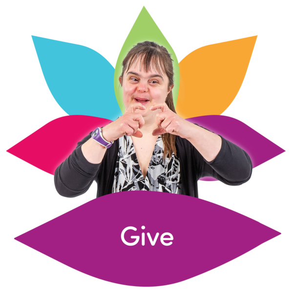 Lady making heart shape with her hands and the word 'give' written