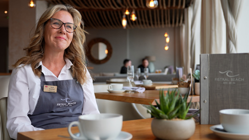 Pictured sat down is Sarah Hyde Wear, Restaurant Supervisor at Fistral Beach Hotel