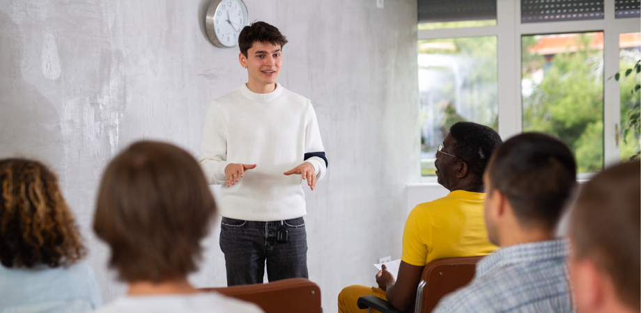 Students listening to speaker in classroom 
