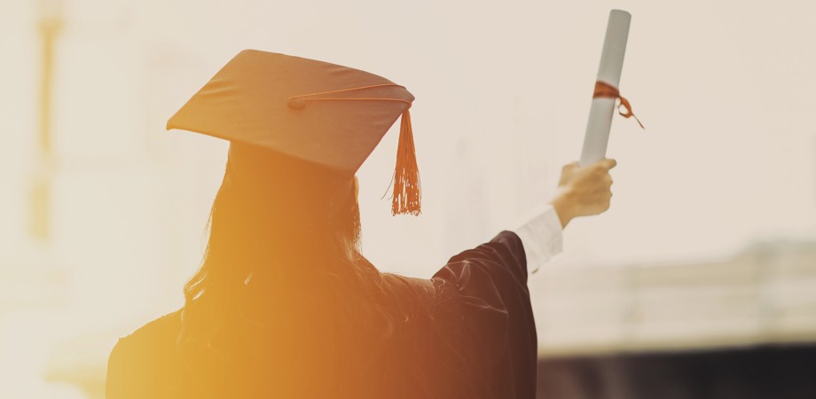Back of a graduate wearing a cap and gown