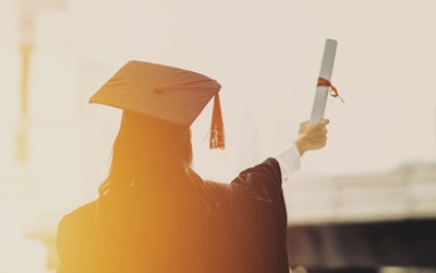 Back of a graduate wearing a cap and gown