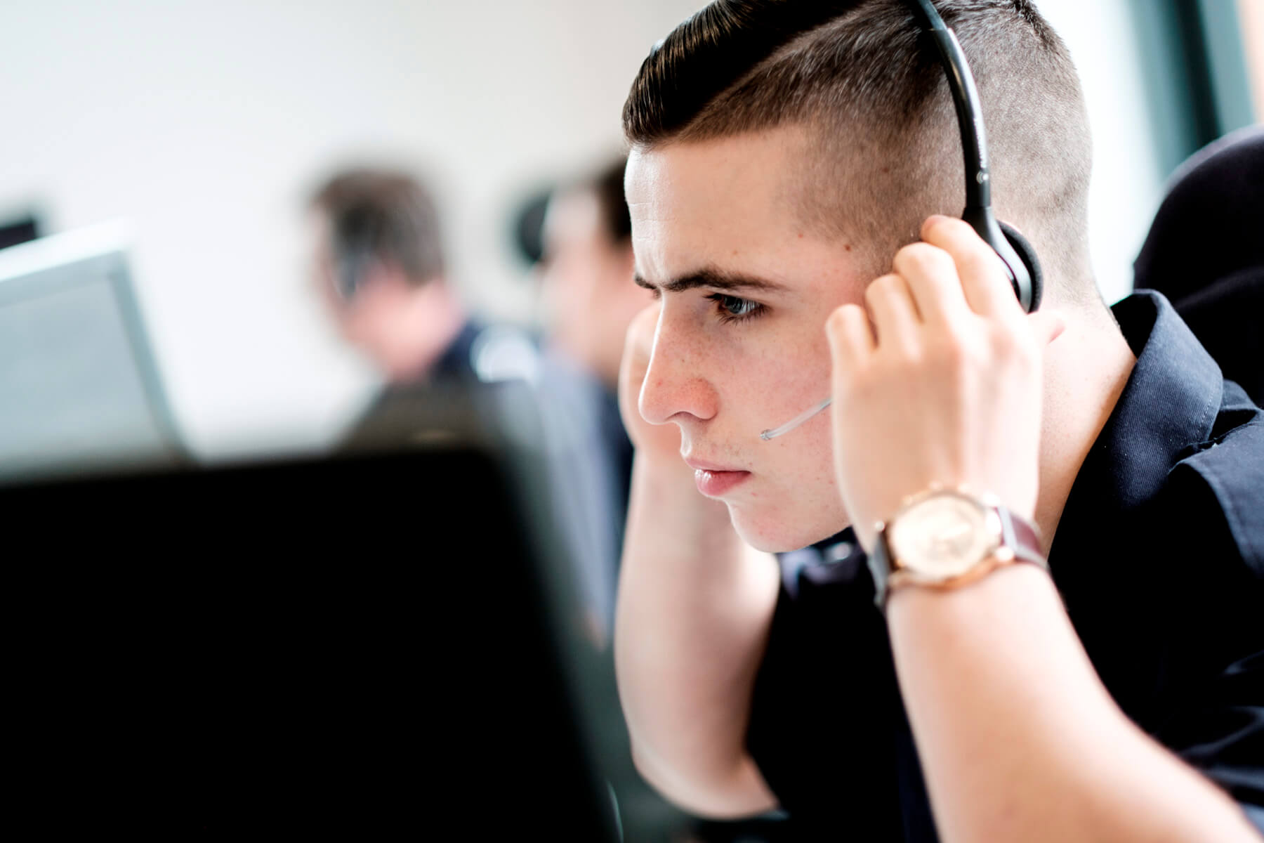 Person putting call centre headset on