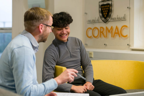Cormac apprentice and mentor seated and chatting
